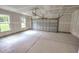 Unfinished two-car garage with concrete floor and windows at 1999 Central Ave, Summerville, SC 29483