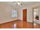 Bright bedroom with hardwood floors and ceiling fan at 209 Fenwick Rd, Walterboro, SC 29488