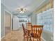 Bright kitchen with white cabinets and dining area at 209 Fenwick Rd, Walterboro, SC 29488