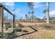 Relaxing backyard with wooden swing and trees at 211 Brailsford Rd, Summerville, SC 29485