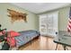 Small bedroom with a twin bed and wood flooring at 211 Brailsford Rd, Summerville, SC 29485