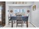 Bright dining area with a table for four and large windows at 211 Brailsford Rd, Summerville, SC 29485