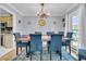 Formal dining room featuring a rustic wood table and blue chairs at 211 Brailsford Rd, Summerville, SC 29485