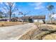 Ranch home with a long driveway and mature trees at 211 Brailsford Rd, Summerville, SC 29485