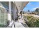 Covered front porch showing plants, view of front yard, and railings at 211 Brailsford Rd, Summerville, SC 29485