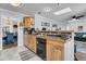 Kitchen with wood cabinets, black appliances, and a breakfast bar at 211 Brailsford Rd, Summerville, SC 29485