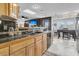 Open kitchen with wood cabinets, black appliances and view to dining area at 211 Brailsford Rd, Summerville, SC 29485