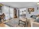 Cozy living room with a neutral sofa and large area rug at 211 Brailsford Rd, Summerville, SC 29485