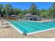 Community pool with lounge chairs and picnic tables at 211 Brailsford Rd, Summerville, SC 29485