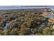 Aerial view of houses and golf course near the water at 219 Sea Cloud Cir, Edisto Island, SC 29438