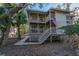 Two-story home with elevated walkway and porch at 219 Sea Cloud Cir, Edisto Island, SC 29438
