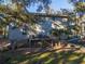 Two-story home with a deck and lush landscaping at 219 Sea Cloud Cir, Edisto Island, SC 29438