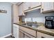 Kitchen features white cabinets and stainless steel sink at 219 Sea Cloud Cir, Edisto Island, SC 29438