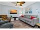 Living room featuring a comfy couch and large TV at 219 Sea Cloud Cir, Edisto Island, SC 29438
