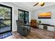Relaxing living room with recliner and access to patio at 219 Sea Cloud Cir, Edisto Island, SC 29438