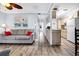 Bright living room with grey sofa and hardwood floors at 219 Sea Cloud Cir, Edisto Island, SC 29438