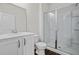 Bathroom with white vanity, toilet and glass shower at 221 Goshen Rd, Moncks Corner, SC 29461