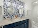 Bathroom with a double vanity and blue floral wallpaper at 2212 Salt Wind Way, Mount Pleasant, SC 29466