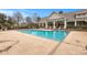 Relaxing community pool area with surrounding lounge chairs at 2244 Ashley Crossing Dr # 1224, Charleston, SC 29414