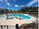 Resort-style pool with lounge chairs and palm trees in a community setting at 2270 Tillage St, Mount Pleasant, SC 29466