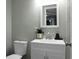 Updated bathroom with white vanity and a modern mirror at 2334 Falcon Rd, North Charleston, SC 29406