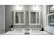 Double vanity bathroom with updated fixtures and large mirrors at 2334 Falcon Rd, North Charleston, SC 29406