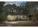 Charming bungalow with gray siding, well-manicured lawn, and inviting front porch at 2334 Falcon Rd, North Charleston, SC 29406