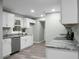 Modern kitchen with white cabinets, granite countertops, and stainless steel appliances at 2334 Falcon Rd, North Charleston, SC 29406