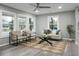 Living room with hardwood floors, large windows, and comfortable seating at 2334 Falcon Rd, North Charleston, SC 29406