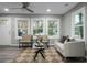 Spacious living area with a cozy seating arrangement and large windows at 2334 Falcon Rd, North Charleston, SC 29406