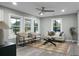 Living room with hardwood floors, large windows, and comfortable seating at 2334 Falcon Rd, North Charleston, SC 29406