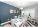 Charming dining room features a white table and blue accents at 2427 Jasper Patterson Dr, Johns Island, SC 29455