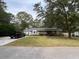 Brick ranch house with a large yard and driveway at 2430 Thaxton St, Charleston, SC 29414