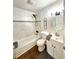 Updated bathroom with marble tile, a bathtub, and modern vanity at 2720 W Surrey Dr, North Charleston, SC 29405