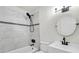 Clean bathroom with marble tile shower, white vanity, and circular mirror at 2720 W Surrey Dr, North Charleston, SC 29405