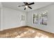 Spacious bedroom with hardwood floors, ceiling fan, and exterior access at 2720 W Surrey Dr, North Charleston, SC 29405