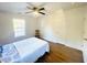 Charming bedroom with hardwood floors and ceiling fan at 2720 W Surrey Dr, North Charleston, SC 29405