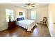 Spacious bedroom with hardwood floors, ceiling fan, and ample natural light at 2720 W Surrey Dr, North Charleston, SC 29405