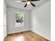 Simple bedroom with hardwood floors and a window at 2720 W Surrey Dr, North Charleston, SC 29405