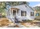 Front view of a charming renovated house with a porch and black shutters at 2720 W Surrey Dr, North Charleston, SC 29405