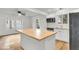 Renovated kitchen featuring white cabinets, wood countertops, and a center island at 2720 W Surrey Dr, North Charleston, SC 29405