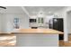 Bright kitchen with white cabinets, butcher block island, and stainless steel appliances at 2720 W Surrey Dr, North Charleston, SC 29405