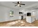 Living room with hardwood floors and an open concept kitchen at 2720 W Surrey Dr, North Charleston, SC 29405