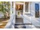 Front porch with whitewashed wood ceiling and white door at 2720 W Surrey Dr, North Charleston, SC 29405