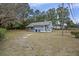 Large backyard with mature trees and a shed at 2736 Bonds Ave, North Charleston, SC 29405