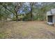 Spacious backyard with mature trees and a covered structure at 2736 Bonds Ave, North Charleston, SC 29405