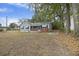 Front view of a charming house with gray siding and a brick base at 2736 Bonds Ave, North Charleston, SC 29405