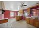 Kitchen with wood cabinets, red walls and built in bar at 2736 Bonds Ave, North Charleston, SC 29405