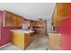 Kitchen with wood cabinets and red walls at 2736 Bonds Ave, North Charleston, SC 29405