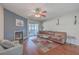 Living room featuring a brown couch, hardwood floors and a fireplace at 2745 Jobee Dr # 205, Charleston, SC 29414